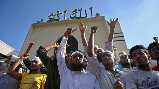 Activists of Islami Andolan Bangladesh, an Islamist political party take part in a protest outside the National Mosque in Dhaka on October 16, 2021. (AFP) Activists of Islami Andolan Bangladesh, an Islamist political party take part in a protest outside the National Mosque in Dhaka on October 16, 2021. (AFP)