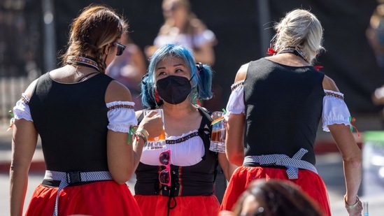Women in costume sample vegan beers at the Vegan Oktoberfest beer festival in Los Angeles on October 16.(AFP)