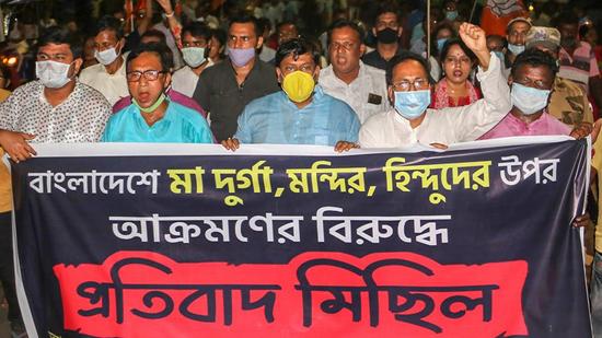 West Bengal BJP workers during a protest rally against the alleged attack on an ISKCON temple in Bangladesh, at Balurghat in South Dinajpur district on Sunday. (PTI PHOTO.) West Bengal BJP workers during a protest rally against the alleged attack on an ISKCON temple in Bangladesh, at Balurghat in South Dinajpur district on Sunday. (PTI PHOTO.)