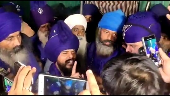 A group of Nihangs address the mediapersons shortly before Saravjeet Singh, the first to claim responsibility for lynching of a man at Singhu border, surrendered to the police.