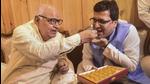 Uttar Pradesh assembly speaker Hriday Narayan Dikshit offers sweets to newly elected deputy speaker Nitin Agarwal at Vidhan Bhavan in Lucknow on Monday. (PTI Photo)