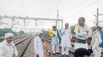 Farmers during the rail roko agitation in Ghaziabad in western Uttar Pradesh on Monday. (PTI Photo)
