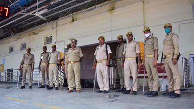 Security personnel at Lakhimpur railway station during the rail roko agitation on Monday. (HT Photo)