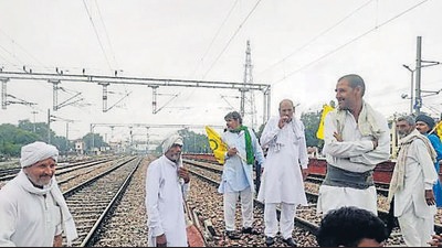 Farmers during the rail roko agitation in Ghaziabad in western Uttar Pradesh on Monday. (PTI Photo) Farmers during the rail roko agitation in Ghaziabad in western Uttar Pradesh on Monday. (PTI Photo)