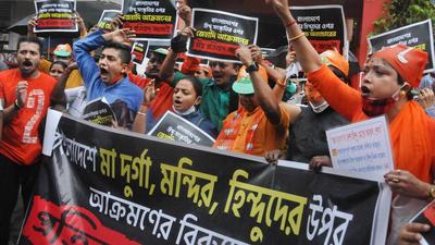 Kolkata: BJP activists protest against alleged attack on Hindus in Bangladesh, in front of Bharat Sevashram Sangha headquarters in Kolkata, Monday, (PTI)
