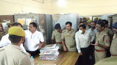 Investigating officials at the site where a lawyer was shot dead by a colleague, in a district court in UP on Monday. Investigating officials at the site where a lawyer was shot dead by a colleague, in a district court in UP on Monday.