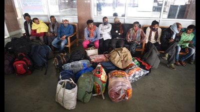 Migrant workers waiting to board a train in Srinagar on Monday. Non-local workers are leaving Kashmir after the recent attacks by militants. (Waseem Andrabi/HT) Migrant workers waiting to board a train in Srinagar on Monday. Non-local workers are leaving Kashmir after the recent attacks by militants. (Waseem Andrabi/HT)