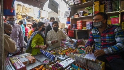 Lakshmi Puja is marked on the second day of Diwali, which is also the darkest day of the traditional month. In this photo, people buy firecrackers from a shop ahead of the festival. (HT Photo/Amal KS) Lakshmi Puja is marked on the second day of Diwali, which is also the darkest day of the traditional month. In this photo, people buy firecrackers from a shop ahead of the festival. (HT Photo/Amal KS)