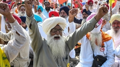 Farmers shout slogans as they gather at a railway station in Amritsar on October 18 during nationwide 'Rail Roko' or stopping of trains protest days after eight people died in an incident involving protesting farmers in Lakhimpur Kheri district of Uttar Pradesh.&nbsp; (AFP)