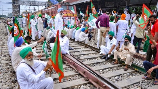 Members of various farmers organizations block railway tracks during the 'rail roko' protest against the central government in Patiala.(PTI)