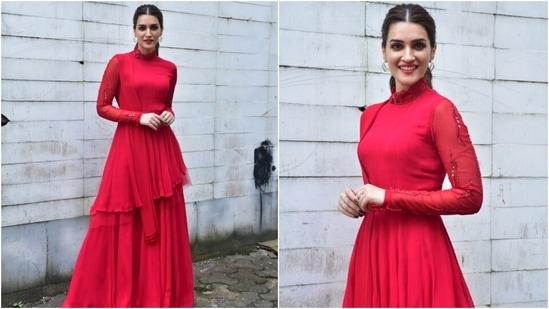 Kriti teamed the kurta with flared sharara pants in a bright red shade. She accessorised her outfit with double hoop silver earrings, rings, and juttis. She tied her locks in a middle-parted sleek ponytail, and for glam, she chose red lip shade and minimal make-up.(HT Photo/Varinder Chawla)