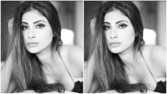 The midriff-baring dress adorned by Mouni showed off her curves perfectly as she posed while lying down on a bed of sorts.(Instagram/@imouniroy)