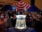 Visitors at the National Museum look at a display of the lunar rock samples retrieved from the moon by China's Chang'e 5 lunar lander late last year in Beijing. (AP Photo/Ng Han Guan, File) Visitors at the National Museum look at a display of the lunar rock samples retrieved from the moon by China's Chang'e 5 lunar lander late last year in Beijing. (AP Photo/Ng Han Guan, File)