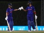 India's KL Rahul, right, and Ishan Kishan celebrate scoring runs during the Cricket Twenty20 World Cup warm-up match between India and England in Dubai, UAE, Monday, Oct. 18, 2021. (AP Photo/Aijaz Rahi)(AP)