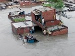 Houses get partially submerged in floodwater due to incessant rainfall, in Rudrapur, Uttarakhand, on Tuesday. (ANI) Houses get partially submerged in floodwater due to incessant rainfall, in Rudrapur, Uttarakhand, on Tuesday. (ANI)