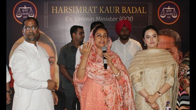 Shiromani Akali Dal MP Harsimrat Kaur Badal with party leader Anil Joshi in Amritsar on Tuesday.