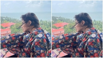 In a blue salwar suit, printed with red and white floral motifs, Mouni posed by a balcony. (Instagram/@imouniroy) In a blue salwar suit, printed with red and white floral motifs, Mouni posed by a balcony. (Instagram/@imouniroy)