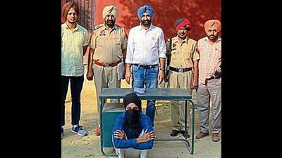 An alleged operative of a foreign-funded terror module in police custody in Sangrur. An alleged operative of a foreign-funded terror module in police custody in Sangrur.