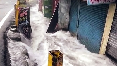 Water gushes out from Nainital Lake as it overflows and floods the streets due to incessant rainfall, in Nainital on Tuesday. (ANI ) Water gushes out from Nainital Lake as it overflows and floods the streets due to incessant rainfall, in Nainital on Tuesday. (ANI )