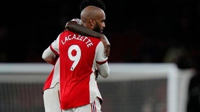Arsenal's Alexandre Lacazette, front is hugged by Arsenal's Thomas Partey at the end of an English Premier League soccer match between Arsenal and Crystal Palace at the Emirates Stadium in London, England, Monday Oct. 18, 2021. (AP Photo/Alastair Grant) (AP) Arsenal's Alexandre Lacazette, front is hugged by Arsenal's Thomas Partey at the end of an English Premier League soccer match between Arsenal and Crystal Palace at the Emirates Stadium in London, England, Monday Oct. 18, 2021. (AP Photo/Alastair Grant) (AP)