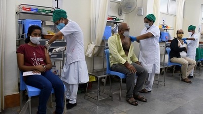People get a shot of the Covid-19 vaccine during a vaccination drive at Nair Hospital in Mumbai. (ANI Photo) People get a shot of the Covid-19 vaccine during a vaccination drive at Nair Hospital in Mumbai. (ANI Photo)