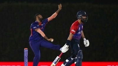 India's Jasprit Bumrah, left, bowls past England's Moeen Ali during the Cricket Twenty20 World Cup warm-up match between India and England in Dubai, UAE, Monday, Oct. 18, 2021. (AP Photo/Aijaz Rahi) (AP) India's Jasprit Bumrah, left, bowls past England's Moeen Ali during the Cricket Twenty20 World Cup warm-up match between India and England in Dubai, UAE, Monday, Oct. 18, 2021. (AP Photo/Aijaz Rahi) (AP)