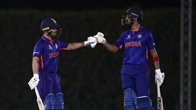 India's KL Rahul, right, and Ishan Kishan celebrate scoring runs during the Cricket Twenty20 World Cup warm-up match between India and England in Dubai, UAE, Monday, Oct. 18, 2021. (AP Photo/Aijaz Rahi) (AP) India's KL Rahul, right, and Ishan Kishan celebrate scoring runs during the Cricket Twenty20 World Cup warm-up match between India and England in Dubai, UAE, Monday, Oct. 18, 2021. (AP Photo/Aijaz Rahi) (AP)