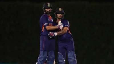 India's captain Virat Kohli, left, congratulates teammate Ishan Kishan on scoring fifty runs during the Cricket Twenty20 World Cup warm-up match between India and England in Dubai, UAE, Monday, Oct. 18, 2021. (AP Photo/Aijaz Rahi) (AP) India's captain Virat Kohli, left, congratulates teammate Ishan Kishan on scoring fifty runs during the Cricket Twenty20 World Cup warm-up match between India and England in Dubai, UAE, Monday, Oct. 18, 2021. (AP Photo/Aijaz Rahi) (AP)