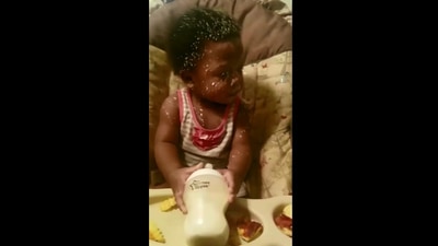 The image shows a kid covered in milk. (Instagram/@eugenetukei)