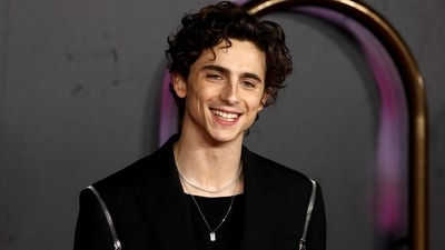 Timothee Chalamet smiles for the camera at the Dune screening in London. (REUTERS) 