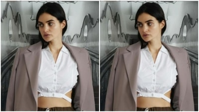 She shared how the same white shirt can be adorned to make a formal fashion statement. She added grey trousers and a lavender blazer to it. (Instagram/@gabriellademetriades) She shared how the same white shirt can be adorned to make a formal fashion statement. She added grey trousers and a lavender blazer to it. (Instagram/@gabriellademetriades)