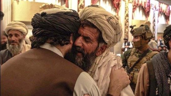 Several photos showed Haqqani embracing relatives of the suicide bombers and praying at the meeting. (TWITTER/@Saeed Khosty.) Several photos showed Haqqani embracing relatives of the suicide bombers and praying at the meeting. (TWITTER/@Saeed Khosty.)