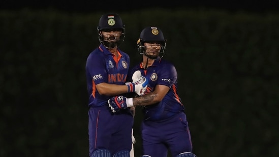 Dubai:India's captain Virat Kohli, left, congratulates teammate Ishan Kishan on scoring fifty runs during the Cricket Twenty20 World Cup warm-up match between India and England in Dubai, UAE, Monday, Oct. 18, 2021. AP/PTI Photo(AP10_18_2021_000238B)(AP)