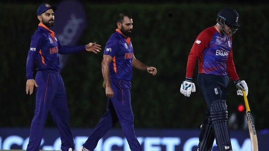 Emirates T20 World Cup Cricket 102 1634648529332 1634648559954 - sociallykeeda India'S Mohammed Shami, Center, Celebrates The Dismissal Of England'S Jos Buttler, Right, During The Cricket Twenty20 World Cup Warm-Up Match Between India And England In Dubai, Uae, Monday, Oct. 18, 2021. (Ap Photo/Aijaz Rahi)(Ap)