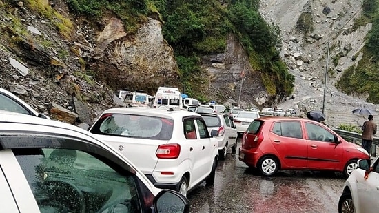 Vehicles are stuck at the Badrinath highway after it was blocked due to the falling of debris following heavy rain in Chamoli in Uttarakhand.&nbsp;(ANI Photo)