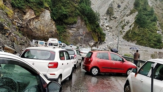Vehicles are stuck at the Badrinath highway after it was blocked due to the falling of debris following heavy rain in Chamoli in Uttarakhand.&nbsp;(ANI Photo)