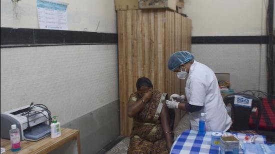 A beneficiary gets vaccinated in Pune, on Monday. As of Tuesday, Pune district has reported 367 new Covid-19 cases and three deaths due to the infection. (SHANKAR NARAYAN/HT)