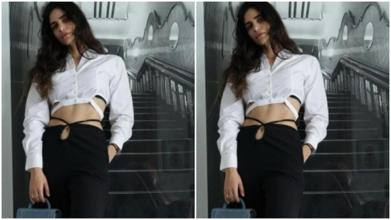 She styled her favourite cropped white shirt with a pair of black trousers with a tie back detail.(Instagram/@gabriellademetriades)