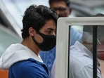Aryan Khan is escorted to court by Narcotics Control Bureau officials for a bail plea hearing in Mumbai on October 8.(AFP Photo) Aryan Khan is escorted to court by Narcotics Control Bureau officials for a bail plea hearing in Mumbai on October 8.(AFP Photo)