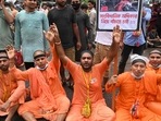 Bangladeshi Hindus stage a demonstration in Dhaka on October 18, 2021 to protest against the fresh religious violence against Hindus in the country. (Photo by Munir UZ ZAMAN / AFP)(AFP) Bangladeshi Hindus stage a demonstration in Dhaka on October 18, 2021 to protest against the fresh religious violence against Hindus in the country. (Photo by Munir UZ ZAMAN / AFP)(AFP)