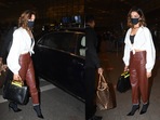 Deepika Padukone stepped out in brown faux leather pants and a white blouse to catch a flight. (Varinder Chawla) Deepika Padukone stepped out in brown faux leather pants and a white blouse to catch a flight. (Varinder Chawla)