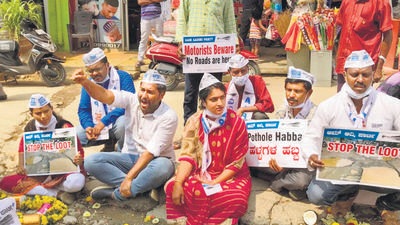 The Aam Aadmi Party (AAP) in Karnataka on Wednesday held a protest against the poor quality of infrastructure in Bengaluru. (Agencies) The Aam Aadmi Party (AAP) in Karnataka on Wednesday held a protest against the poor quality of infrastructure in Bengaluru. (Agencies)