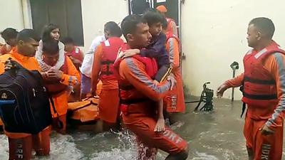 NDRF team carrying out rescue operations at several waterlogged areas due to continuous rainfall, in Rudrapur on Tuesday. (ANI Photo) NDRF team carrying out rescue operations at several waterlogged areas due to continuous rainfall, in Rudrapur on Tuesday. (ANI Photo)