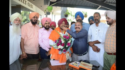 Gill MLA Kuldeep Singh Vaid (centre) celebrating his appointment as chairman-cum-director of the Punjab State Ware Housing Corporation in Ludhiana on Wednesday. (HT photo)