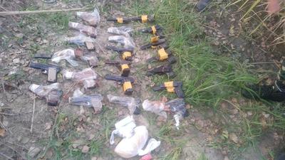 The pistols, ammunition and drugs recovered from a bag found between the barbed wire fence and the zero line on the border with Pakistan in Khemkaran sector of Tarn Taran district after a joint search operation by the Punjab Police and BSF on Wednesday. (HT Photo) The pistols, ammunition and drugs recovered from a bag found between the barbed wire fence and the zero line on the border with Pakistan in Khemkaran sector of Tarn Taran district after a joint search operation by the Punjab Police and BSF on Wednesday. (HT Photo)