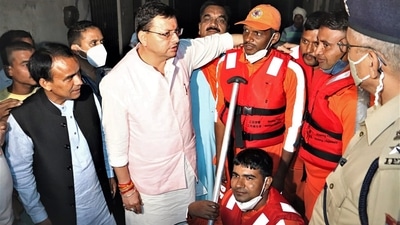 Uttarakhand Chief Minister Pushkar Singh Dhami visited a locality in rain-affected Rudrapur, Udham Singh Nagar district on October 19 and met locals and takes stock of situation from National Disaster Response Force (NDRF) team. (ANI) Uttarakhand Chief Minister Pushkar Singh Dhami visited a locality in rain-affected Rudrapur, Udham Singh Nagar district on October 19 and met locals and takes stock of situation from National Disaster Response Force (NDRF) team. (ANI)