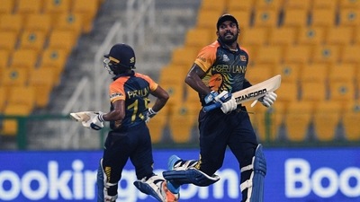 Sri Lanka's Wanindu Hasaranga de Silva (R) and Pathum Nissanka run between the wicket during the ICC Men's T20 World Cup match between Sri Lanka and Ireland, at Sheikh Zayed stadium in Abu Dhabi on Wednesday. (ANI) Sri Lanka's Wanindu Hasaranga de Silva (R) and Pathum Nissanka run between the wicket during the ICC Men's T20 World Cup match between Sri Lanka and Ireland, at Sheikh Zayed stadium in Abu Dhabi on Wednesday. (ANI)