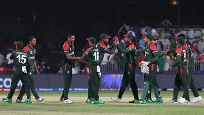 Bangladesh's players shake hands at the end of the Cricket Twenty20 World Cup first round match between Oman and Bangladesh in Muscat, Oman, Tuesday, Oct. 19, 2021. (AP Photo/Kamran Jebreili) (AP)