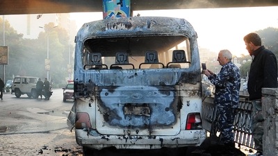 A handout picture released by the official Syrian Arab News Agency (SANA) shows a charred Syrian army bus that was targeted with explosive devices in the Syrian capital of Damascus on October 20, 2021.&nbsp; (AFP)
