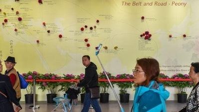 In this file photo, visitors walk past a wall with a map showing the Belt and Road Initiative (BRI) countries, at an exhibition in Beijing, China. India expressed strong opposition to the China-led BRI at a United Nations transport conference in Beijing last week despite a “technical problem”. (REUTERS) In this file photo, visitors walk past a wall with a map showing the Belt and Road Initiative (BRI) countries, at an exhibition in Beijing, China. India expressed strong opposition to the China-led BRI at a United Nations transport conference in Beijing last week despite a “technical problem”. (REUTERS)